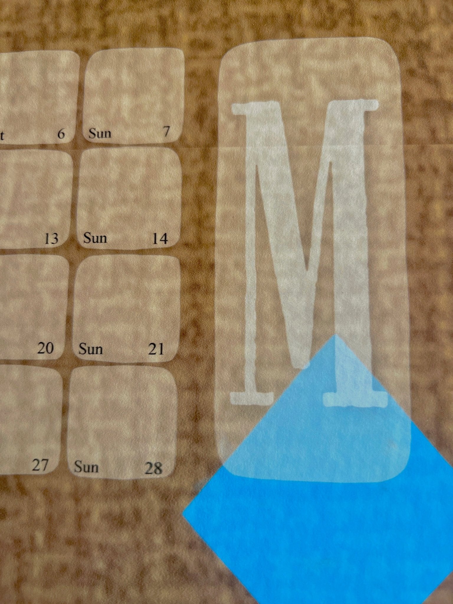 Monatsübersicht  mit Notizfeld und blauer Raute